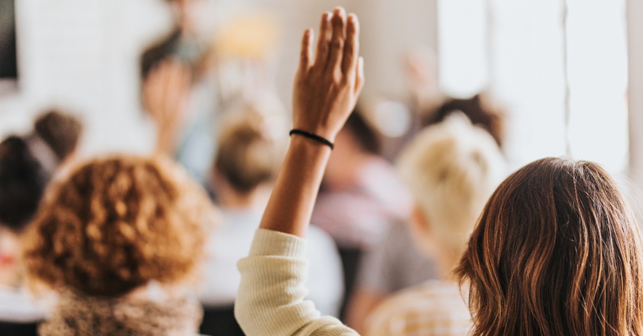 A woman raising her hand, 2 parents are arrested at a Loudon County school board meeting over the county's transgender policy