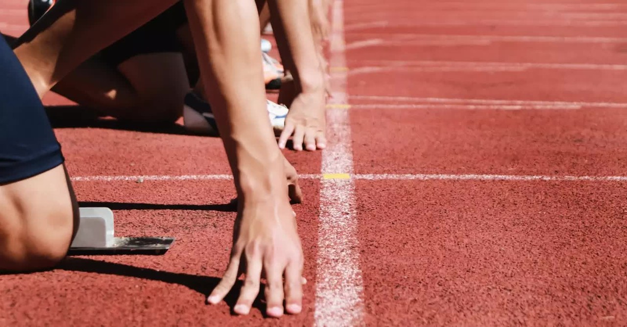 Group of runners lined up at the start of a race