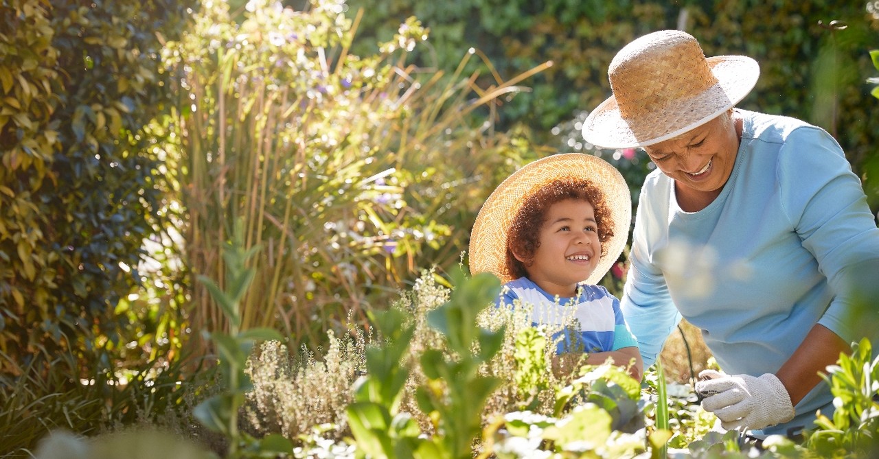 A grandmother and grandson gardening