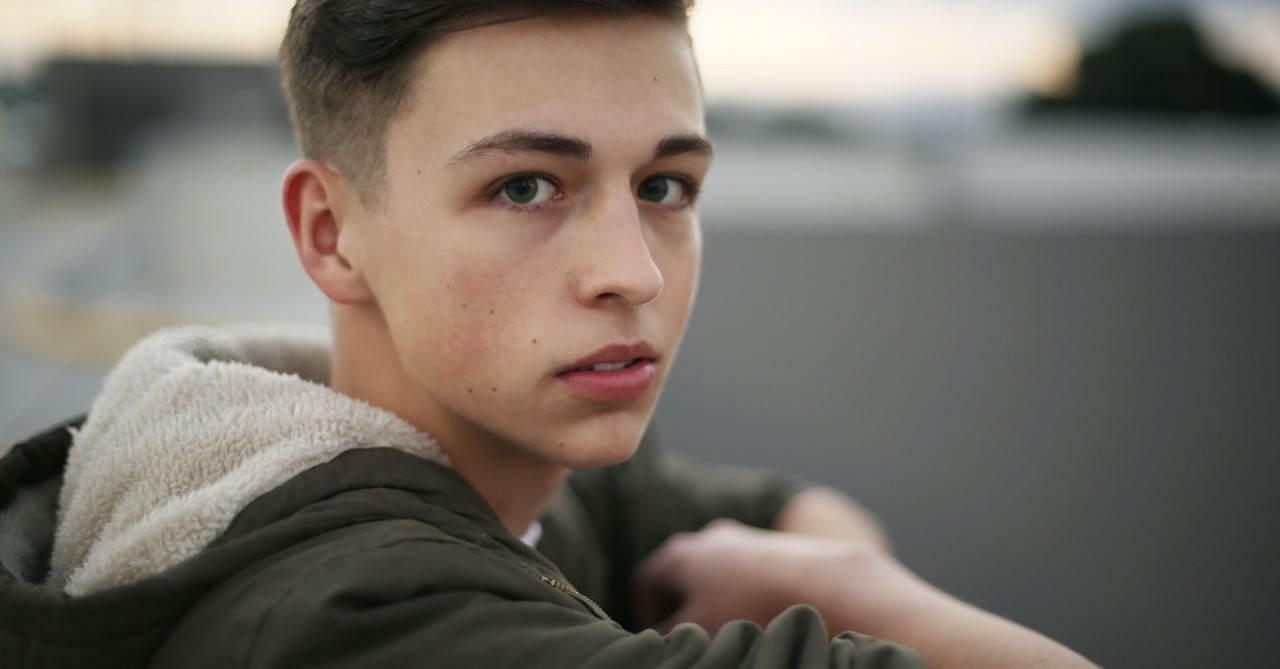 young teenage boy looking at camera