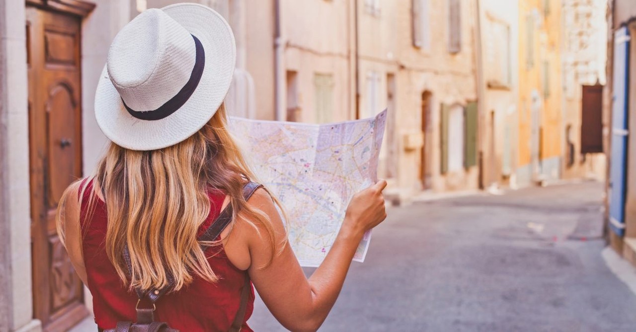 Woman traveling, looking at a map