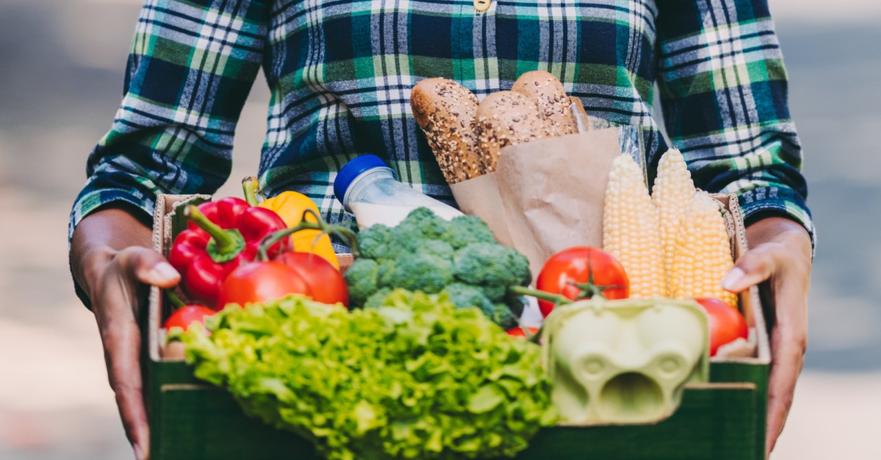 a person holding a box food, 7 things strong christian men do differently