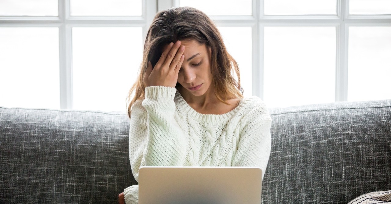 Woman insecure in front of her laptop