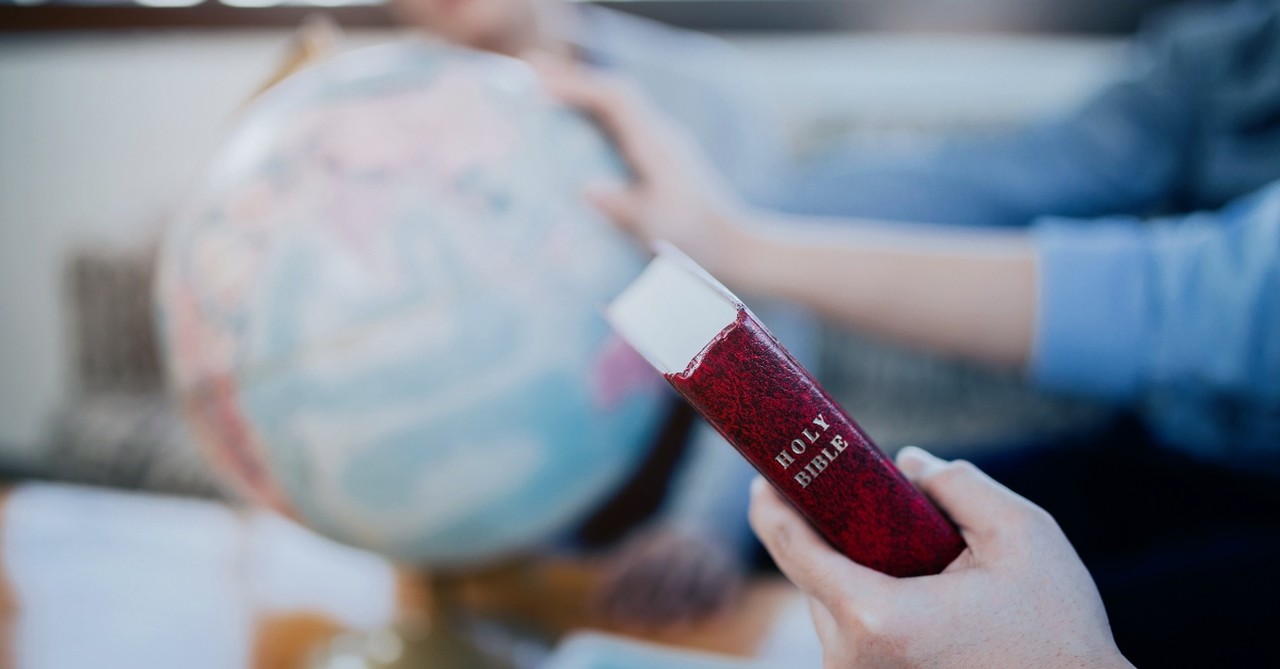 The Bible and a globe