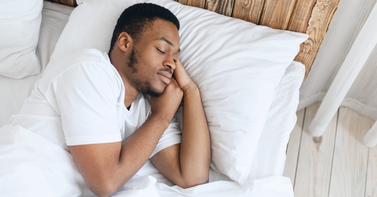 Man sleeping in a bed