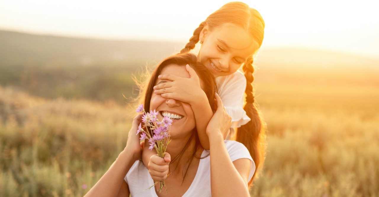 Mom and daughter in field