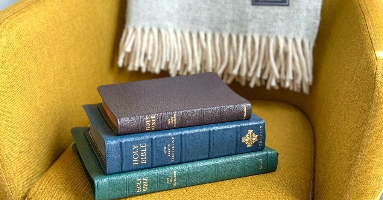 Stack of Bibles on a yellow chair