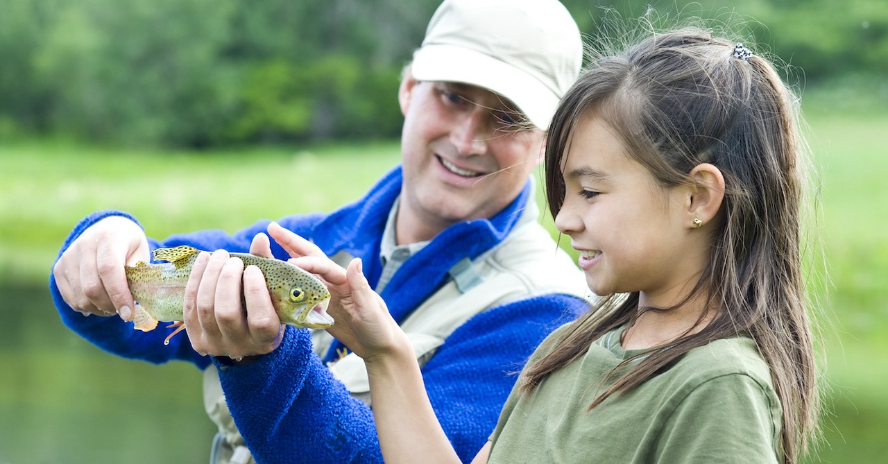 Father fishing with daughter