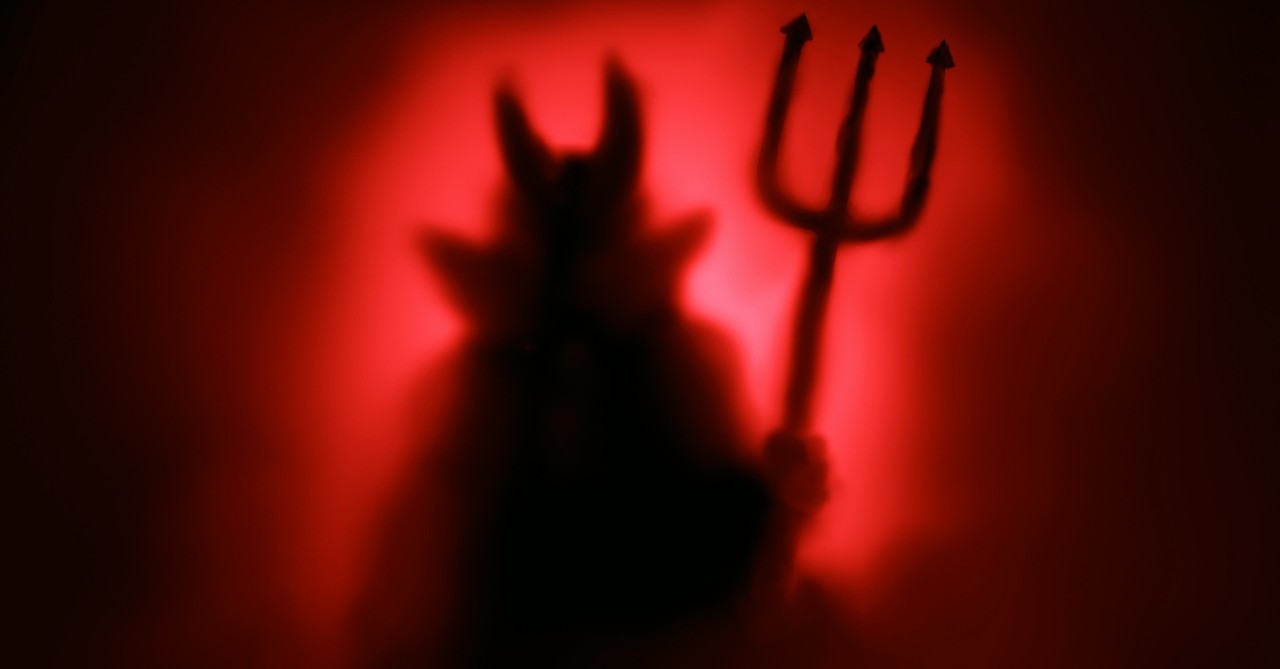 Satan with pitchfork and horns