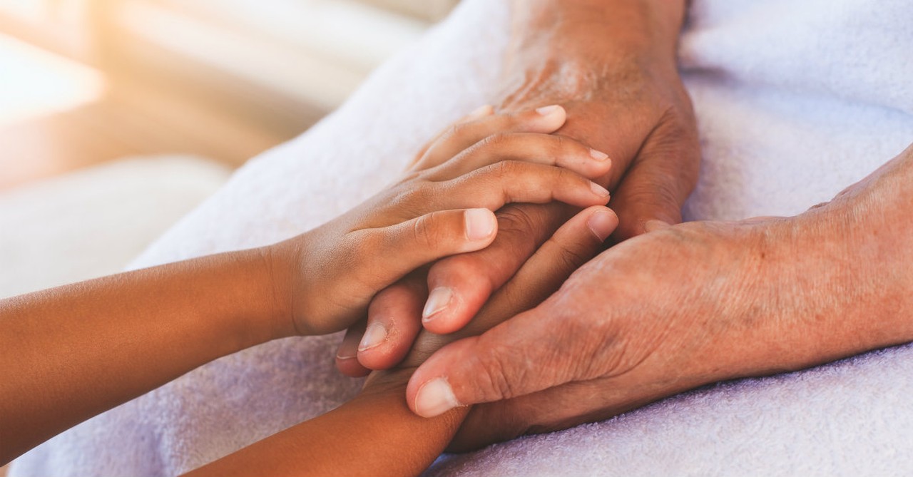 grandparent holding grandchild's hands