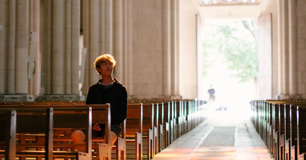 man sitting in pew in empty church, nothing to worry about