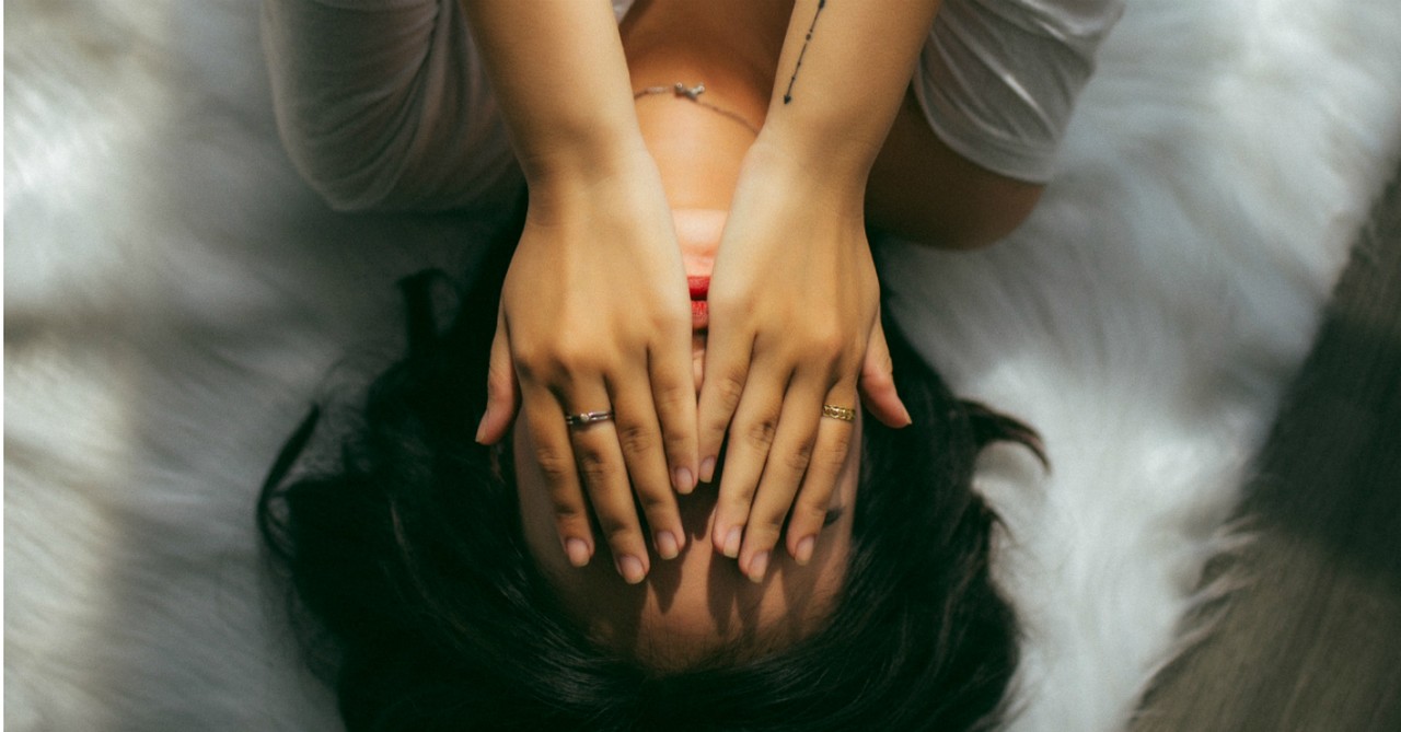 woman covering face