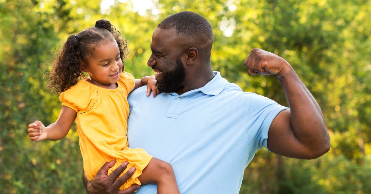 dad holding daughter, Prayers Your Husband Needs You to Pray for Him