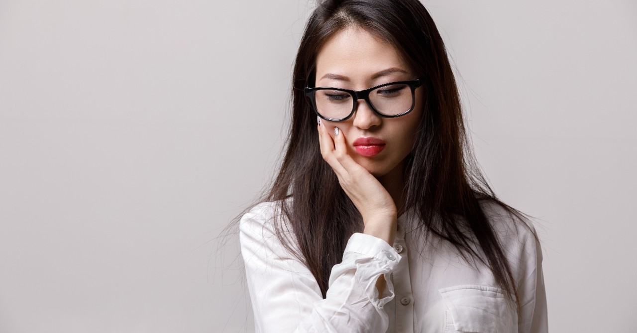 woman looking down in worry