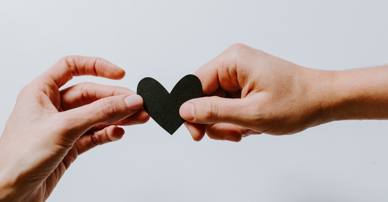 couple holding a heart