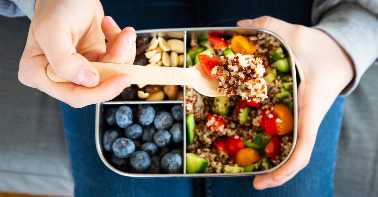 Bento Box full of blueberries, nuts, and a quinoa salad