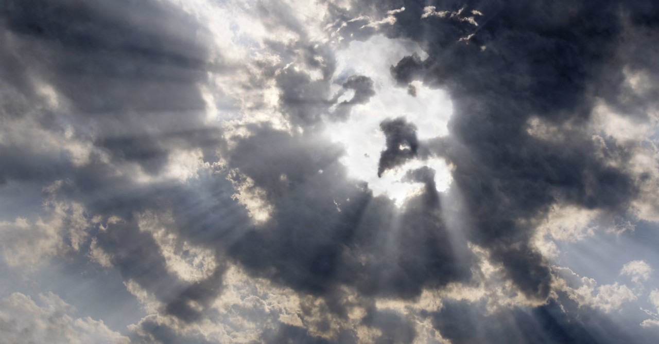 face of jesus shining in clouds