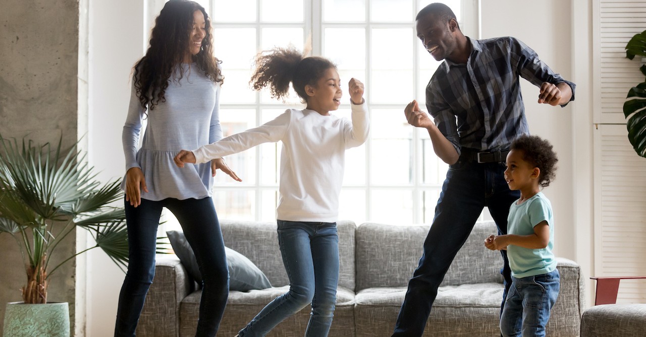 Young family dancing together