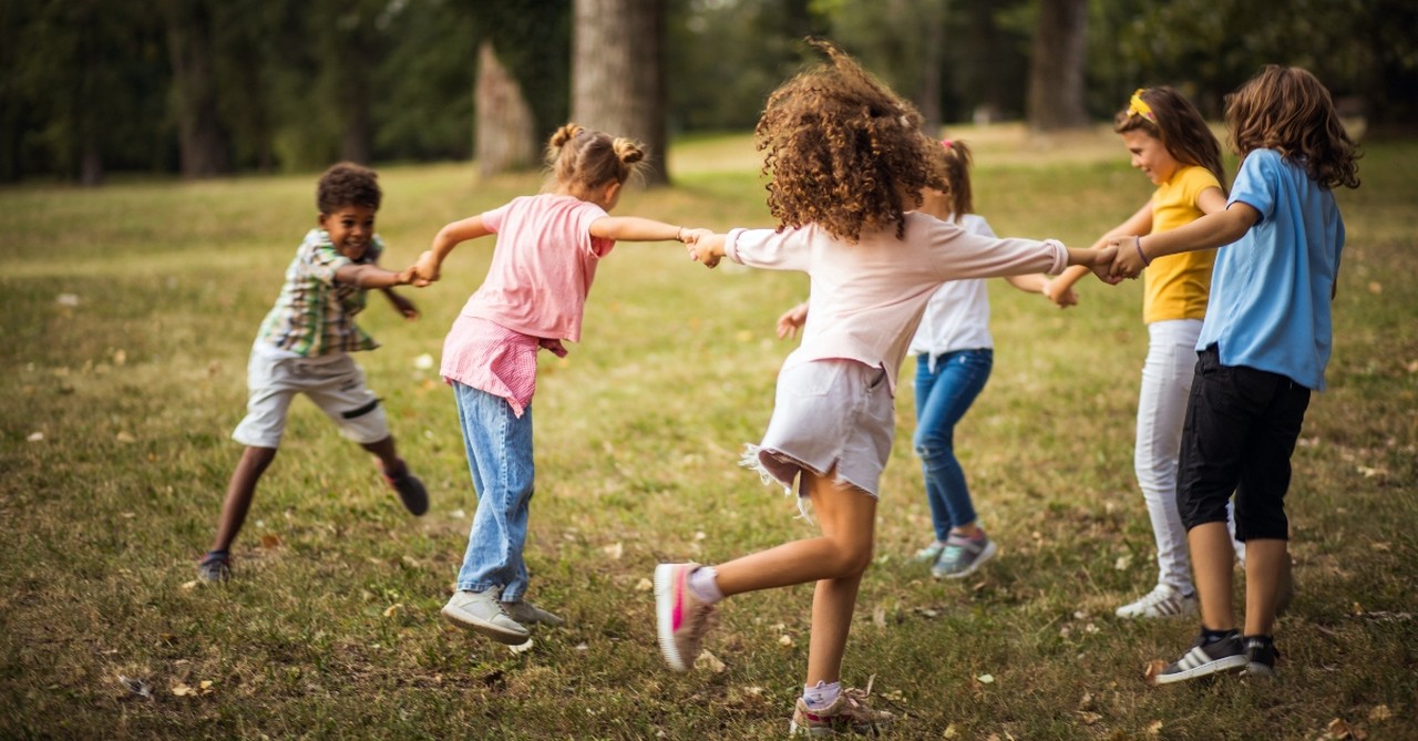 Children playing ring around the rosy