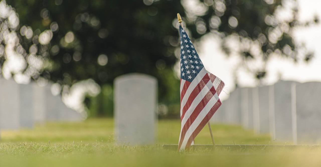 An American flag at a cemetery, understanding the depth of love behind the ultimate sacrifice