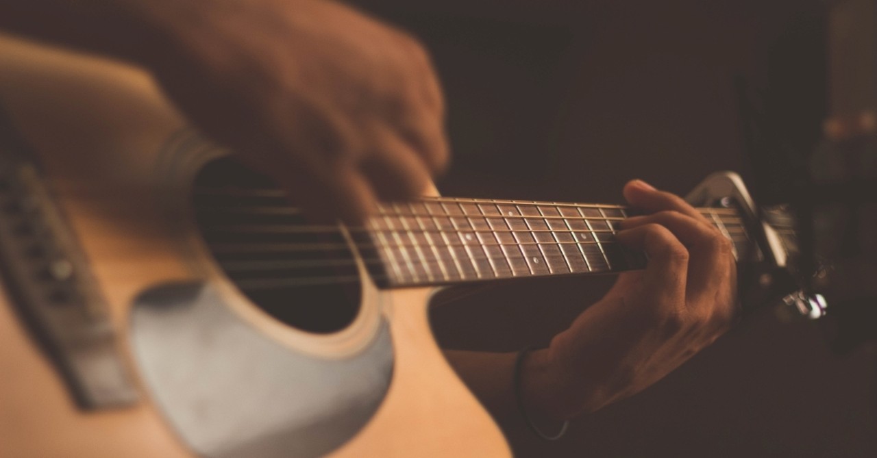 Person playing guitar