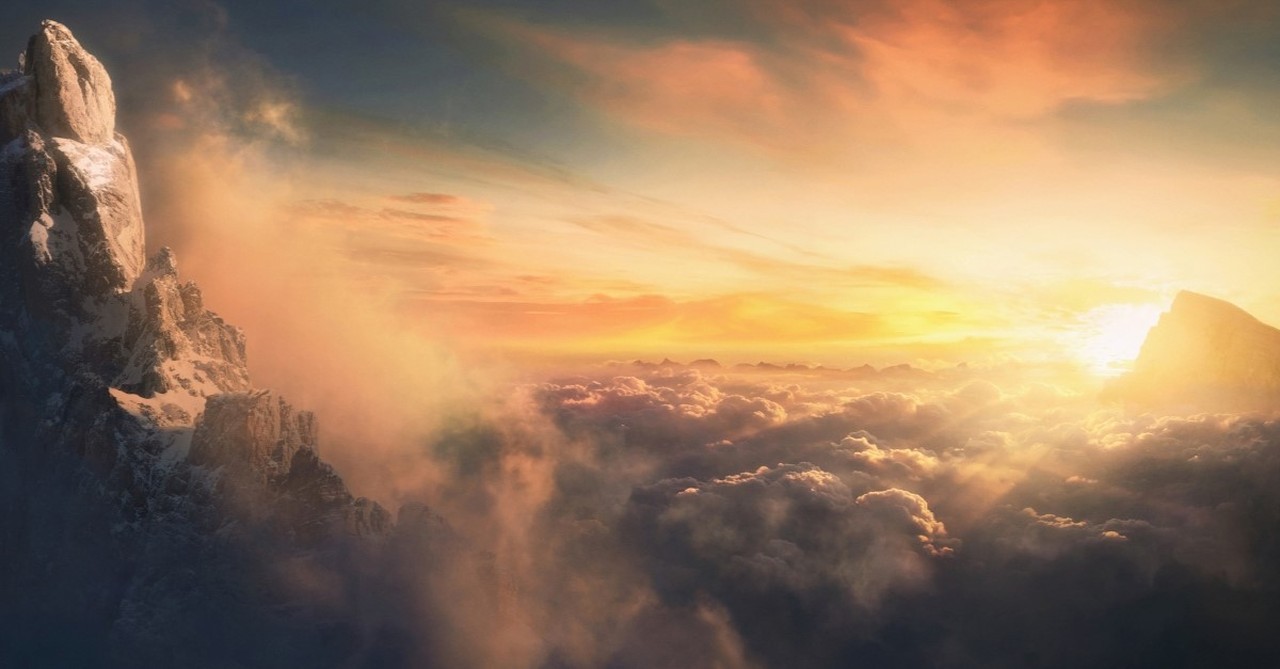 dramatic sunset in cloudy mountains