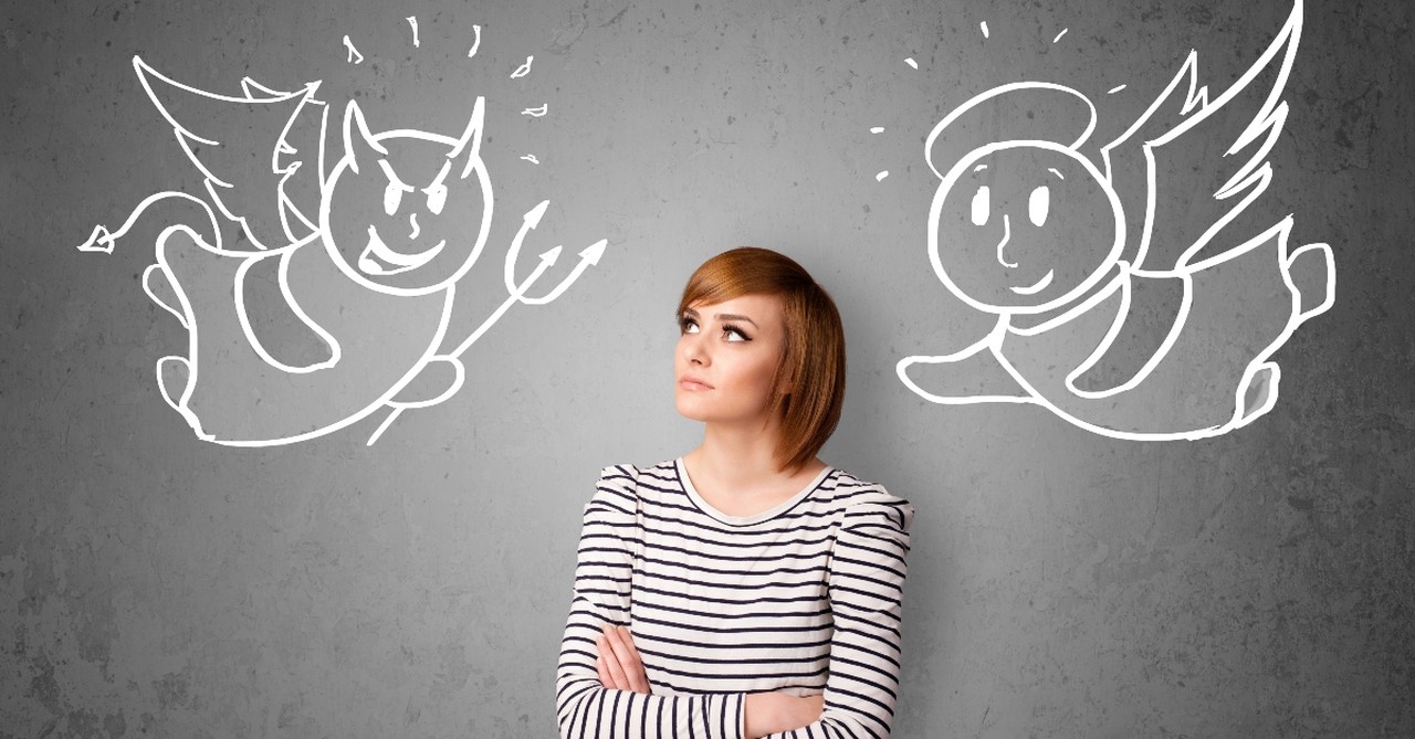 Woman looking at a caricature of a devil and angel