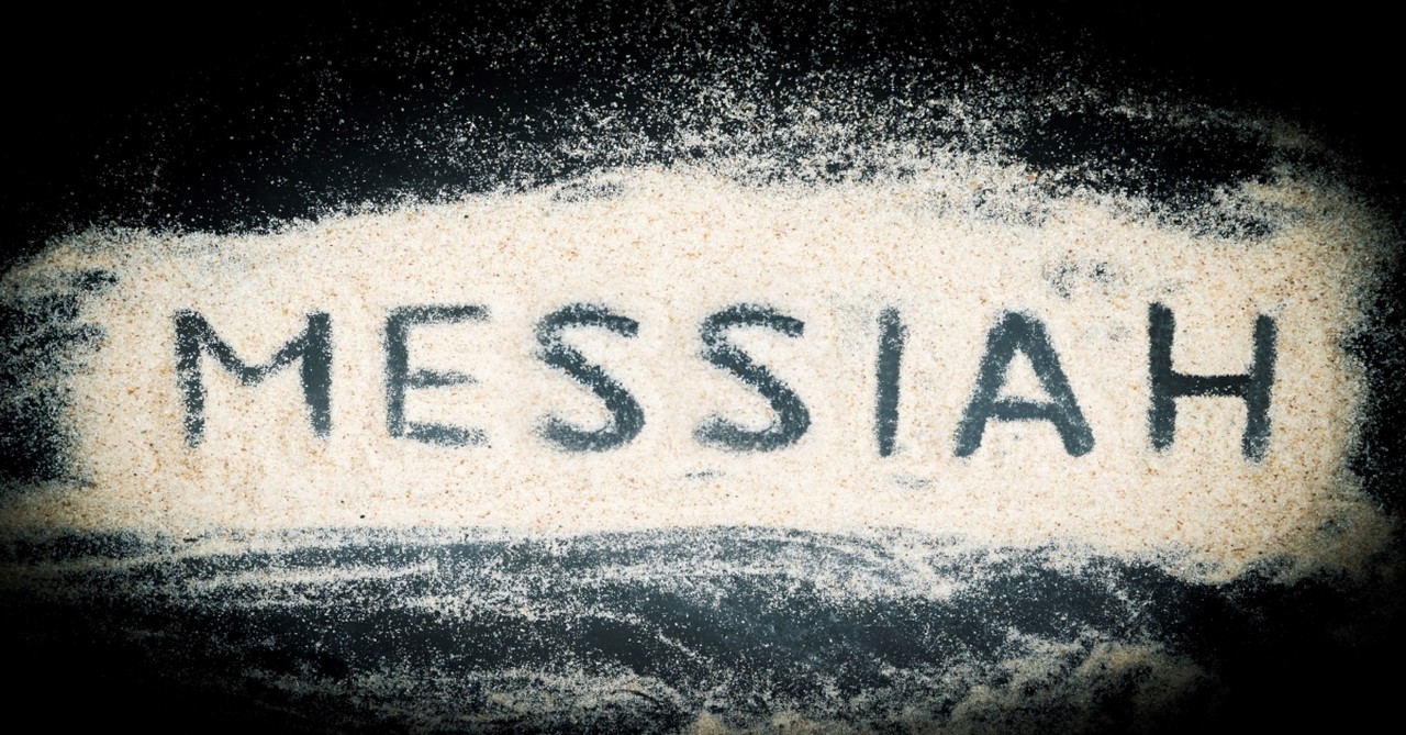 Word Messiah written in sand