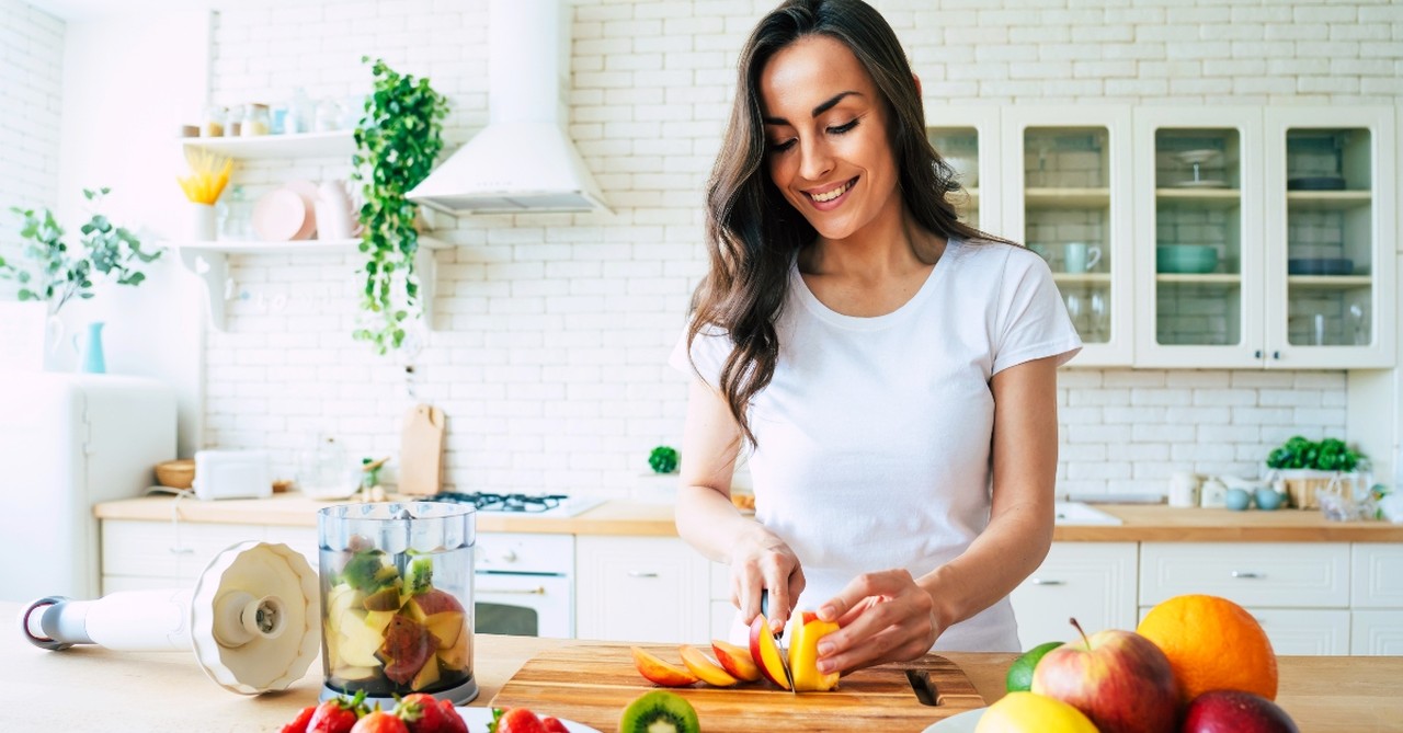 Woman cutting fruit