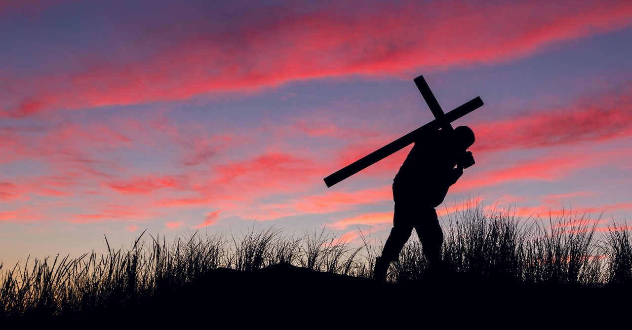 Man carrying a cross