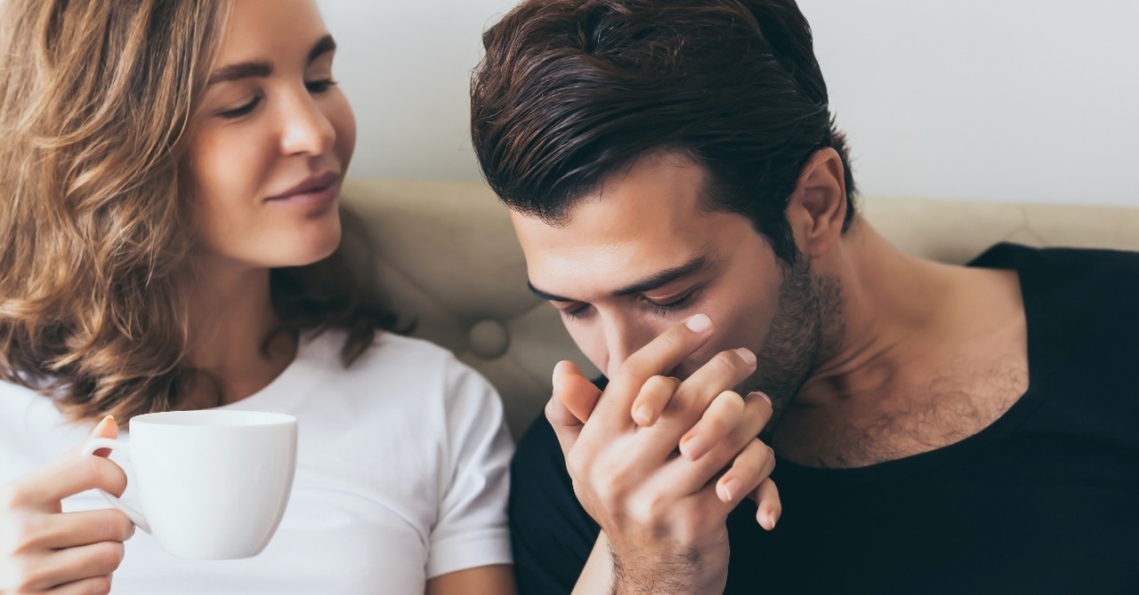 Husband kissing his wife's hand