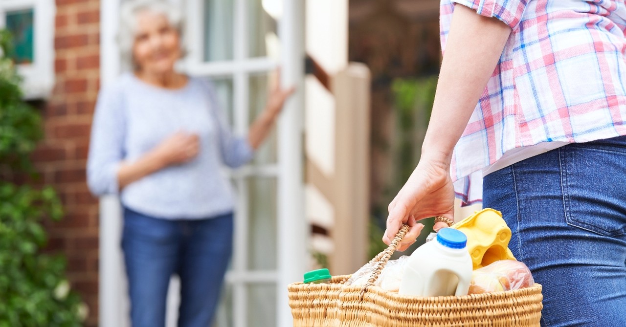 Woman bringing someone groceries