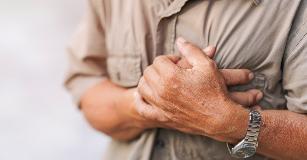 Man clutching his heart