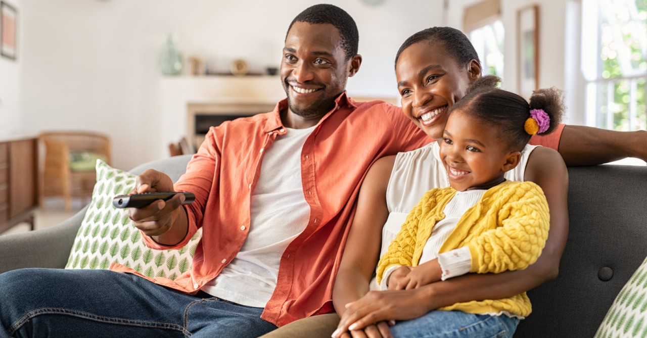 a family watching TV,