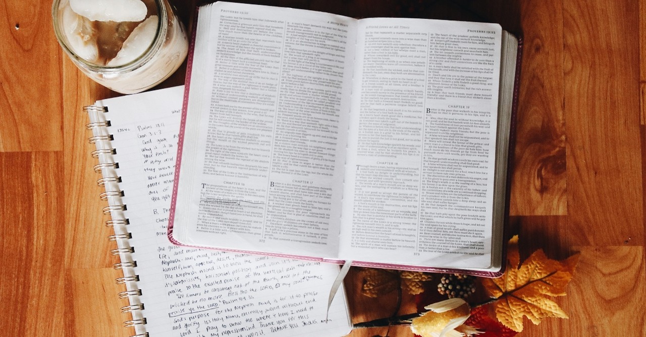 Open Bible with a notebook and Fall leaves