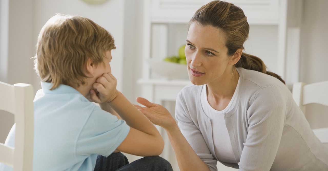 mother and son talking in disciplinary moment