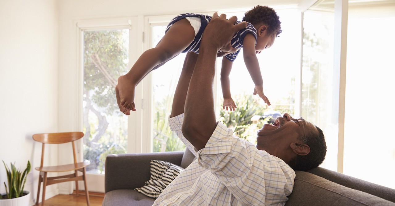 Happy grandparent with baby grandchild