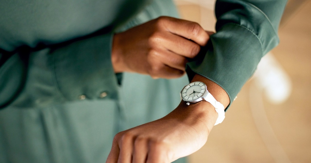 Woman looking at her watch