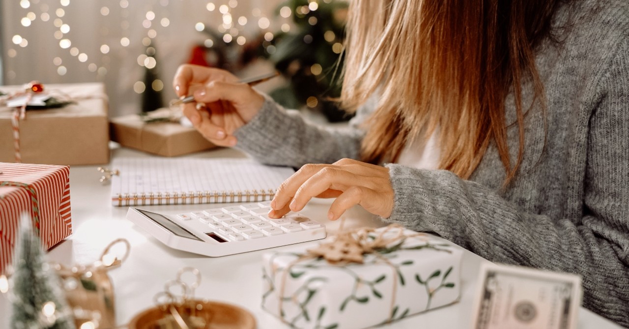 Woman calculating Christmas costs