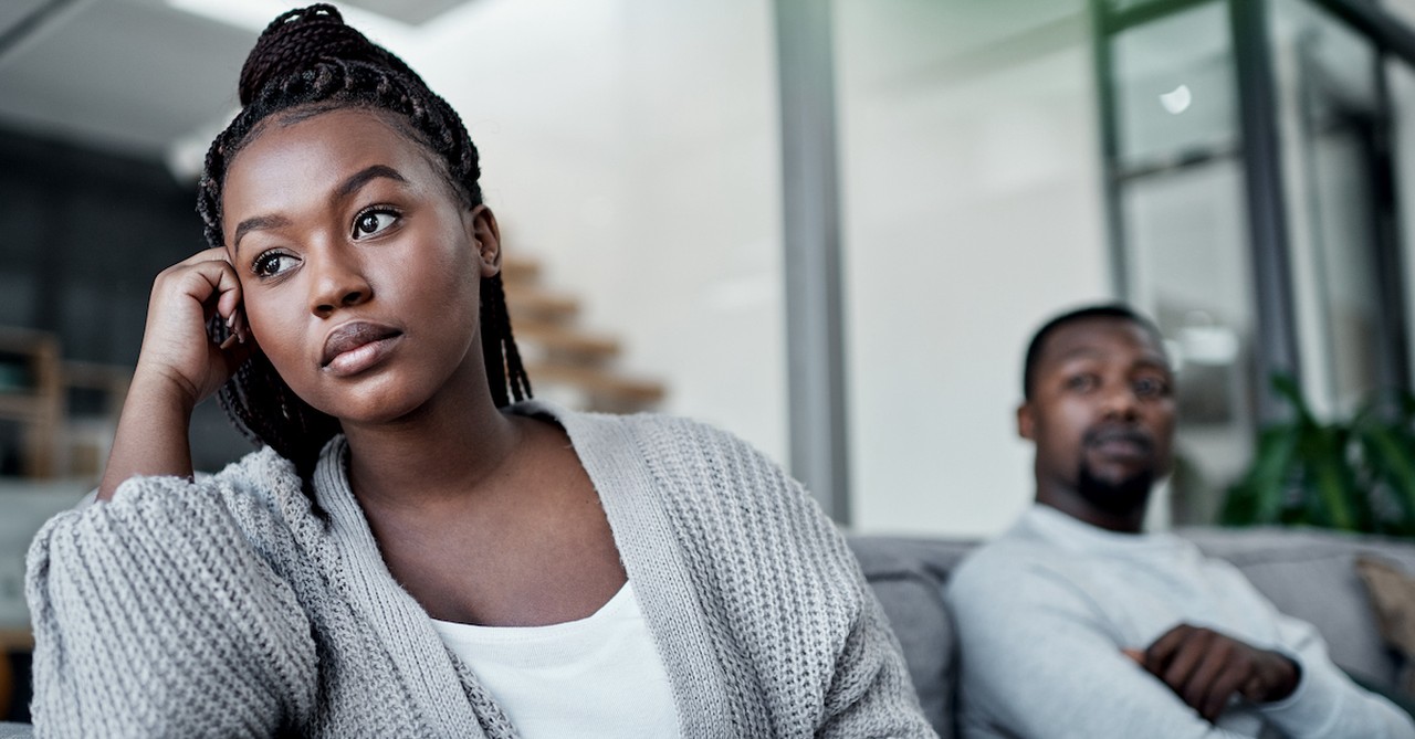 Spouse disappointed on couch in marriage