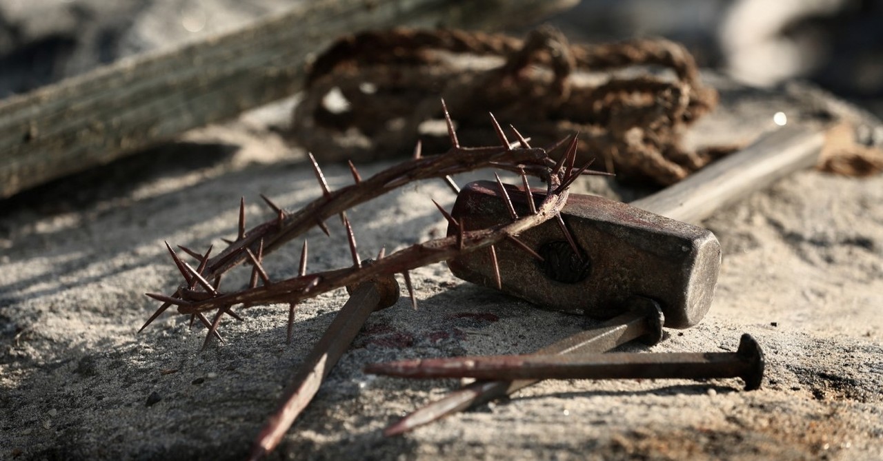 thorny crown and crucifixion tools against cross, crucified with christ