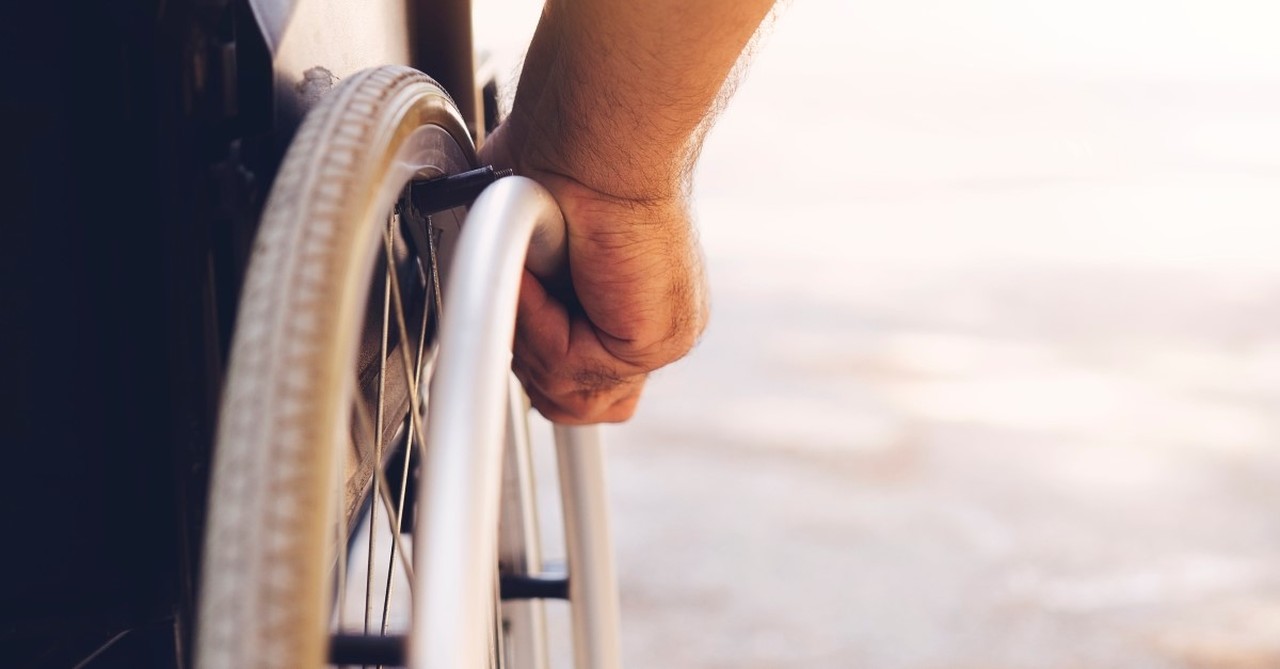 man in wheelchair, impact of technology on christian living and worship