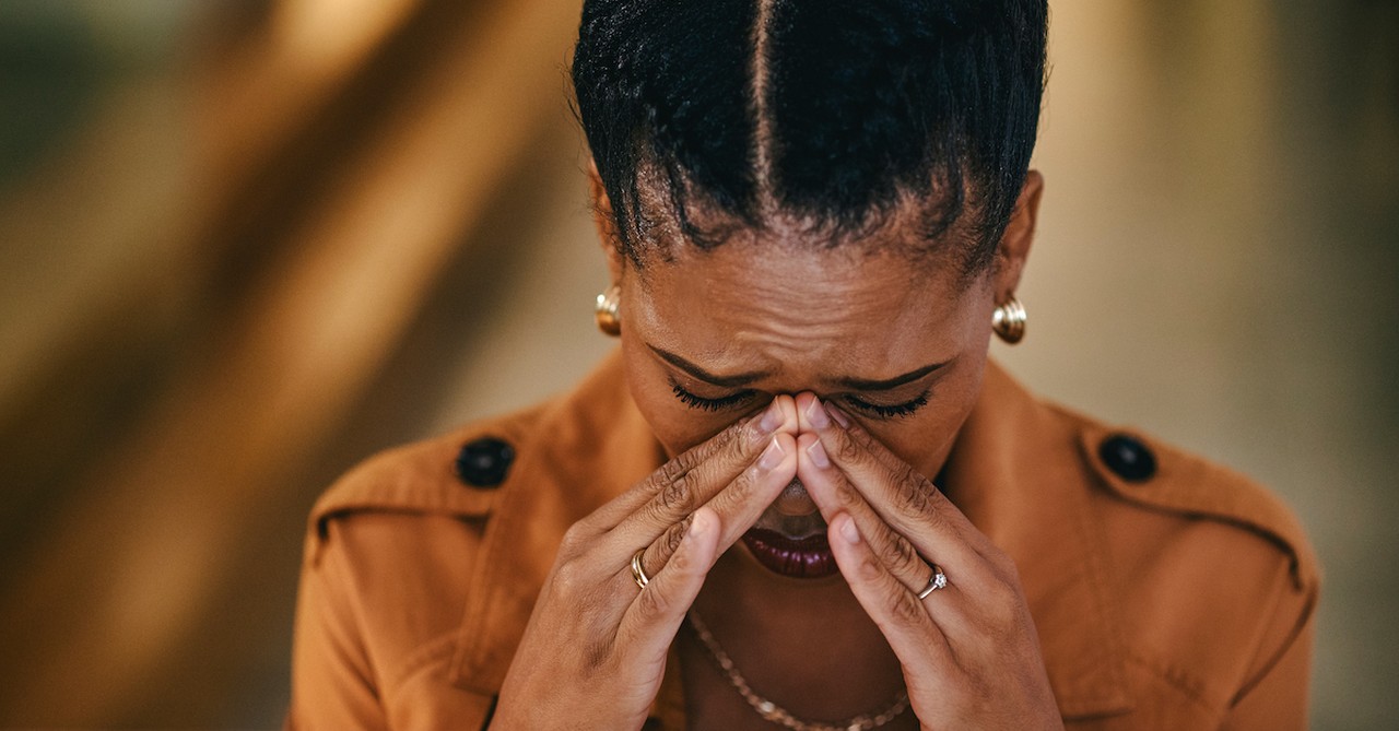 Woman crying sad at computer