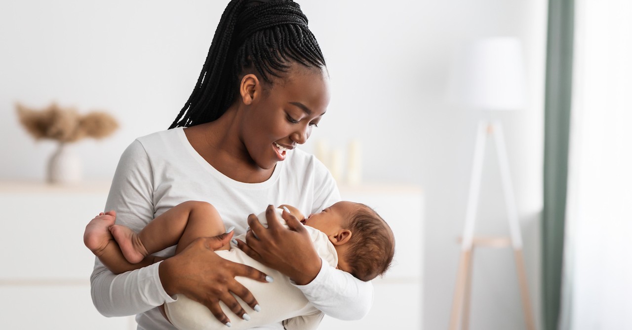 mom holding baby