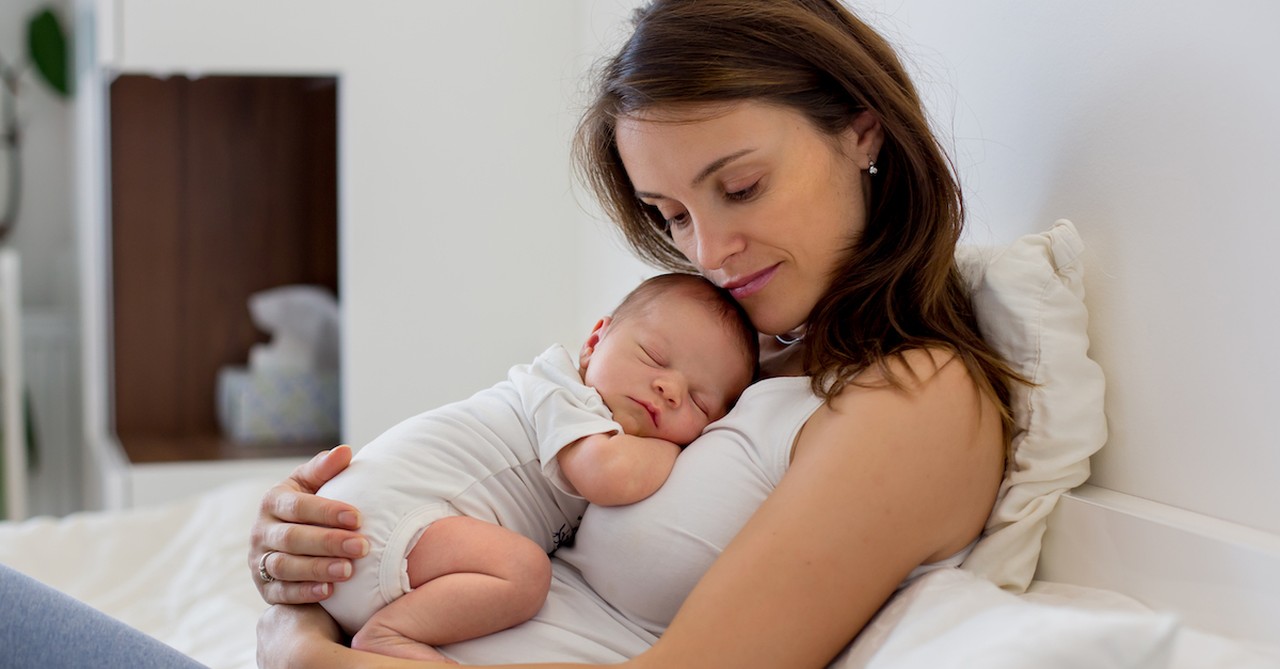 mom holding baby