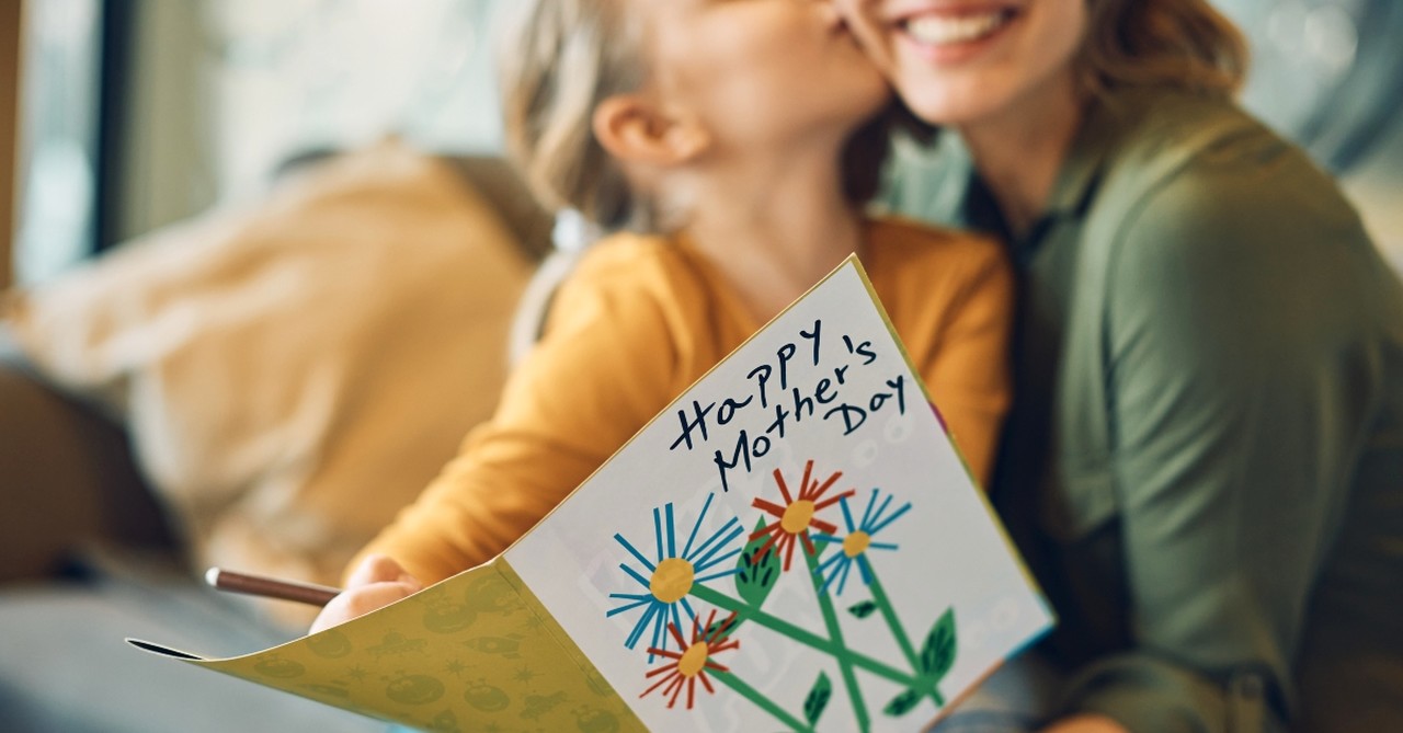 Mother and daughter with Mother's Day Card
