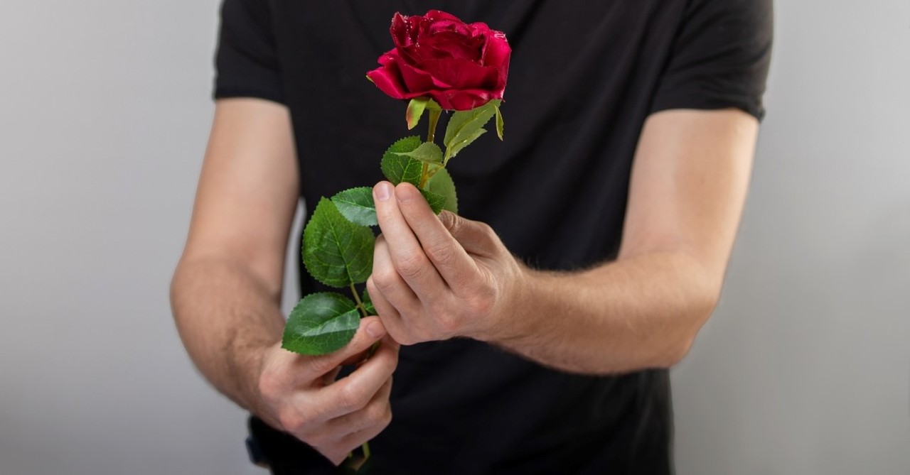 man holding rose