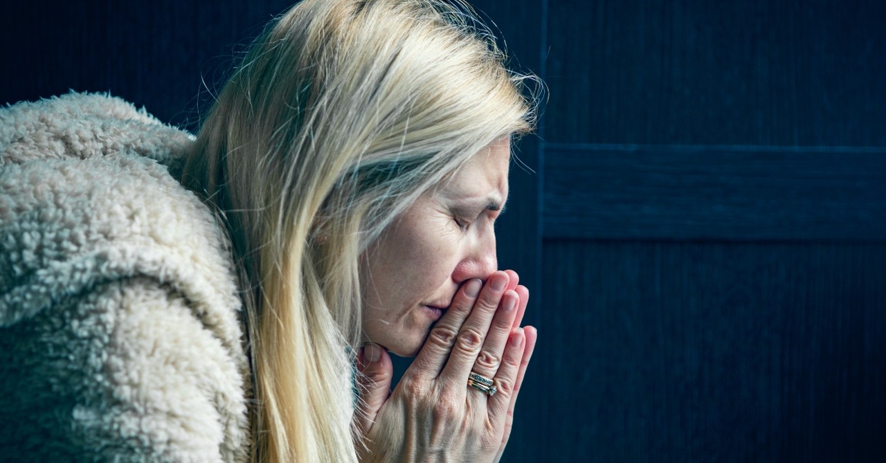 Woman praying in earnest