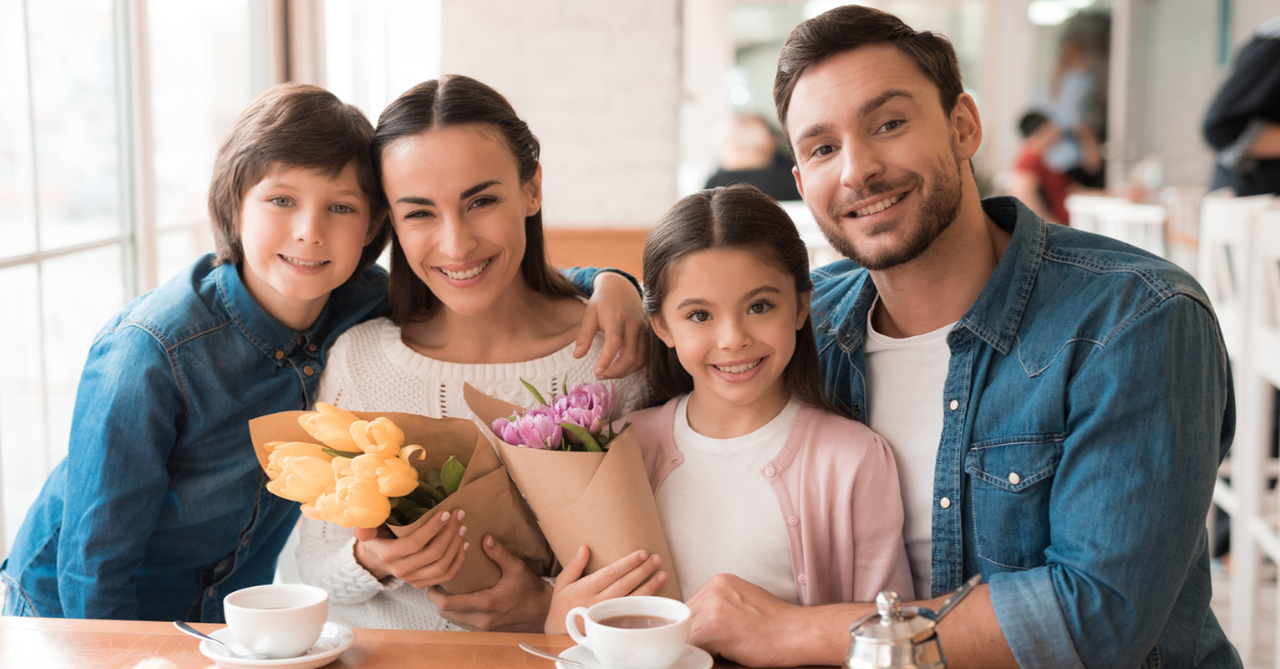 Dad brought flowers to wife and daughter.