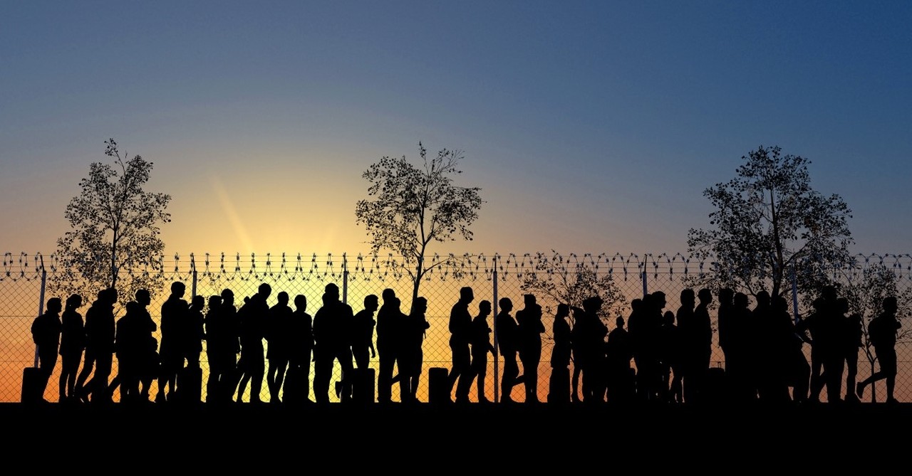 immigrants at chainlink fence, immigration and the gospel